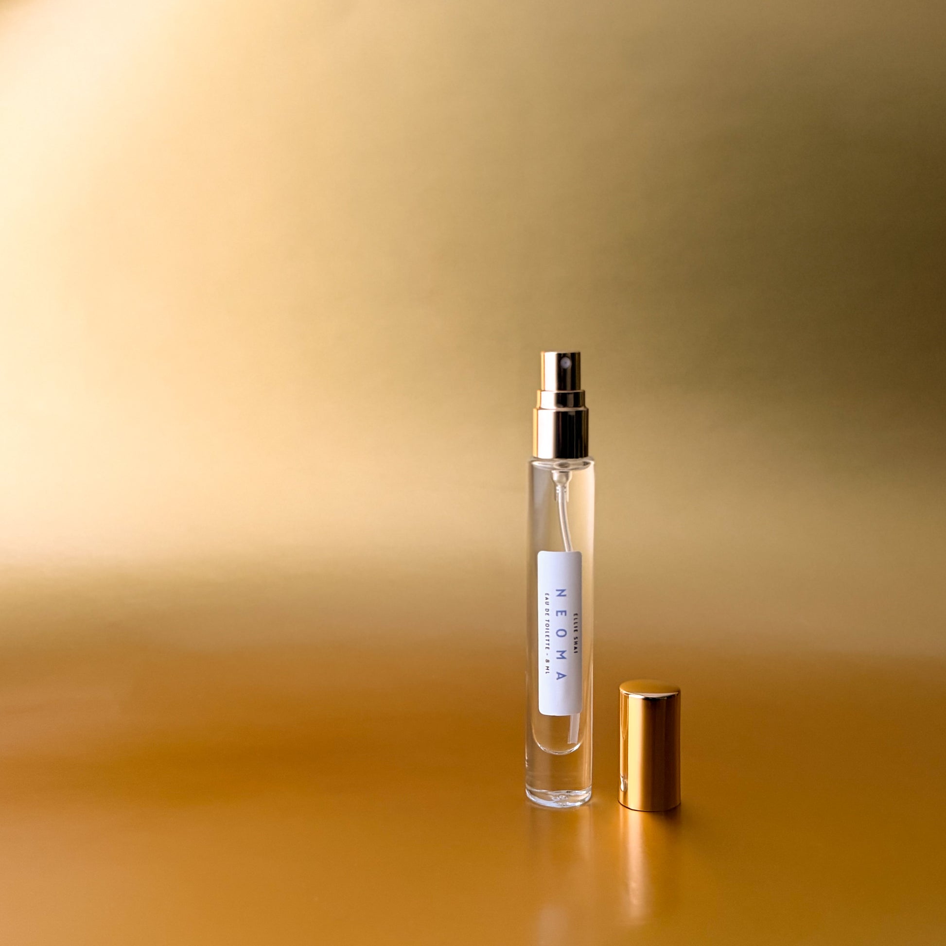 8ml Spray; Clear Glass Bottle with Gold Top and Sprayer; Lightweight Unisex Fragrance; Tangerine, Vanilla, Coconut, Saffron, Cedar Musk and Tonka Bean aroma. 