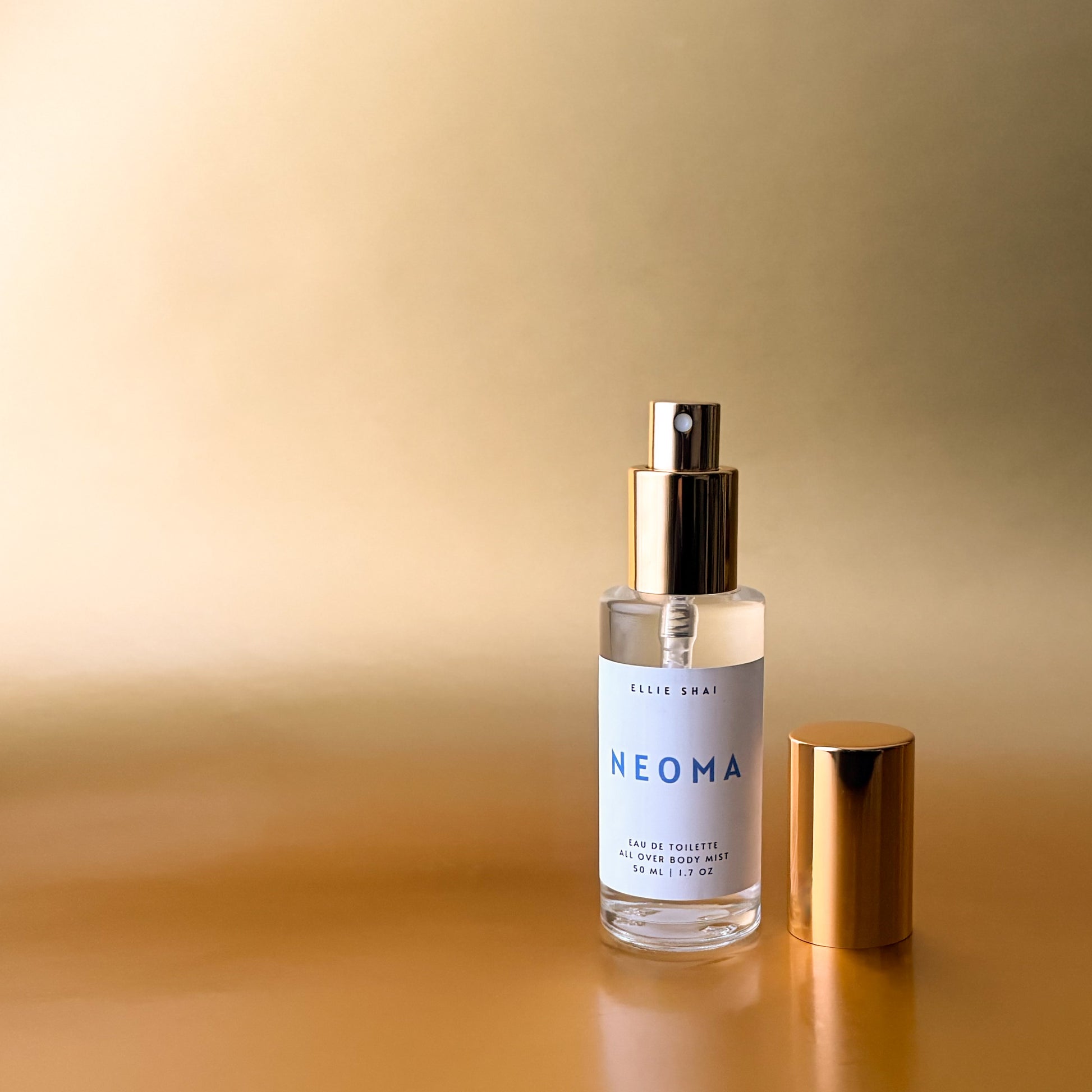 50ml Spray; Clear Glass Bottle with Gold Top and Sprayer; Lightweight Unisex Fragrance; Tangerine, Vanilla, Coconut, Saffron, Cedar Musk and Tonka Bean aroma. 
